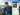 New Zealand dairy farmer viewing a smartphone showing a WhatsApp conversation with a Farm Medix expert, happy with 7-day on-farm support